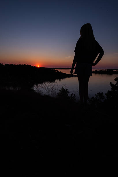 istock Girl watching the sunset 467744096