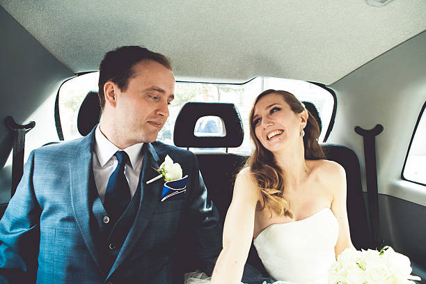 istock Bride and groom in a car 467744168