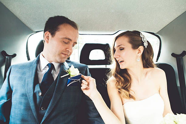 istock Bride and groom in a car 467744170