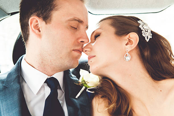 istock Bride and groom in a car 467744172