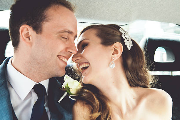 istock Bride and groom in a car 467744176