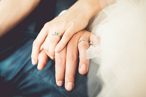 Bride and groom's hands For more wedding photos, please visit the lightbox below: chinese wedding dress stock pictures, royalty-free photos & images