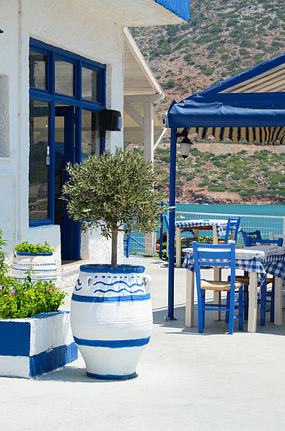 Crete terrace by the sea. Greece. Greek tavern in traditional colors situated near the sea coast herakleion photos stock pictures, royalty-free photos & images