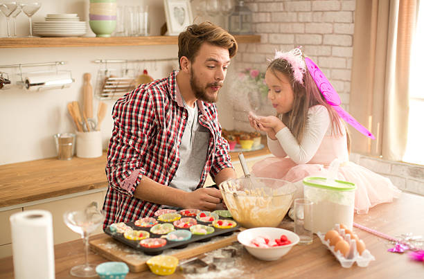istock Father and daughter baking in kitchen. 467745996