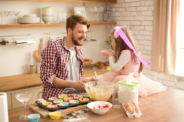 istock Father and daughter baking in kitchen. 467745998