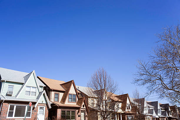 istock Clear Blue Sky above eight row homes 467746348