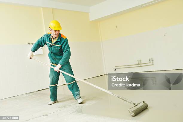 Flooring Works With Selflevelling Mortar Stock Photo - Download Image Now - Concrete, Flooring, Repairing