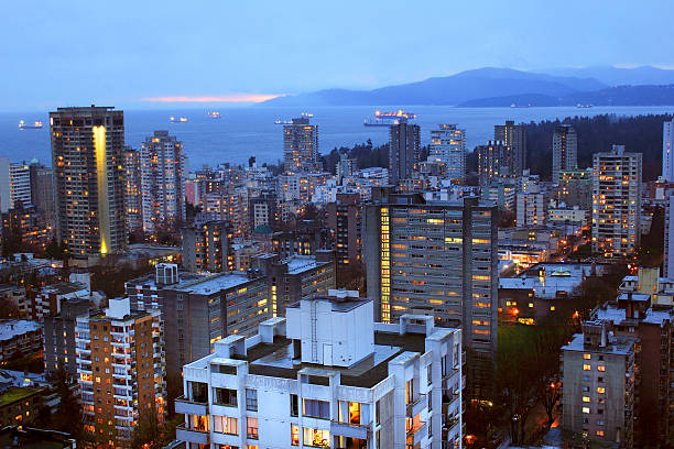 Vancouver, British Columbia, Canada View of West Vancouver and English Bay at night. west vancouver stock pictures, royalty-free photos & images