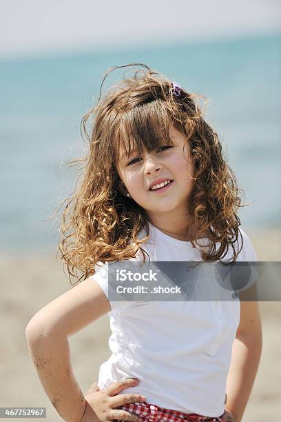 Little Female Child Portrait On The Beach Stock Photo - Download Image Now - Beach, Blue, Child