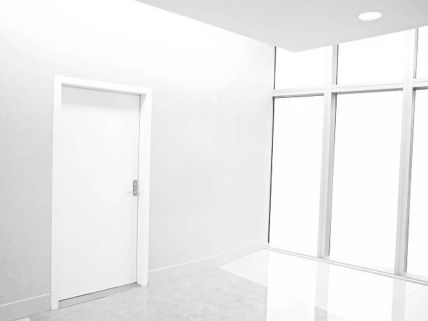 istock White room with white door and windows 467754856