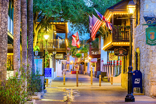 St. Augustine, Florida at St. George Street St. Augustine, Florida, USA - February 5, 2015: Shops and inns line St. George Street. The historic pedestrian street is considered the heart of the city. st george street stock pictures, royalty-free photos & images