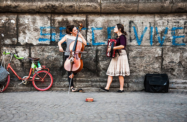 Naples, Italy - June 17, 2014:  two young musicians play music on the street 