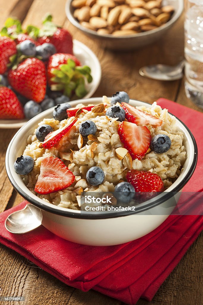 Healthy Homemade Oatmeal with Berries Healthy Homemade Oatmeal with Berries for Breakfast Almond Stock Photo