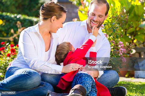 Family On The Garden Lawn Stock Photo - Download Image Now - Activity, Adult, Child