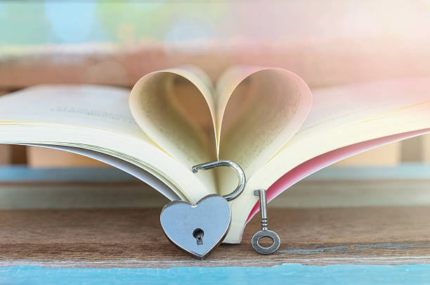 istock Heart shaped padlock with key and Heart book 467758780