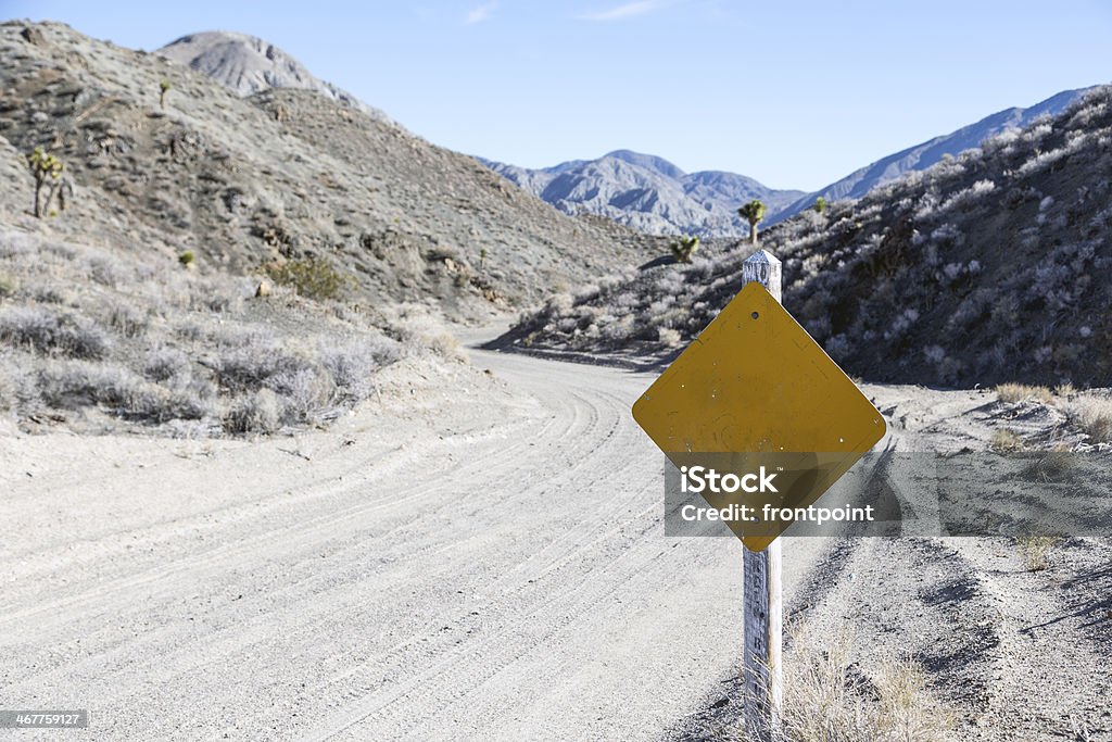 Blank Road Sign in the Desert A beat up road sign along a desert dirt road, place your own copy text. Death Valley, California, USA 2000-2009 Stock Photo