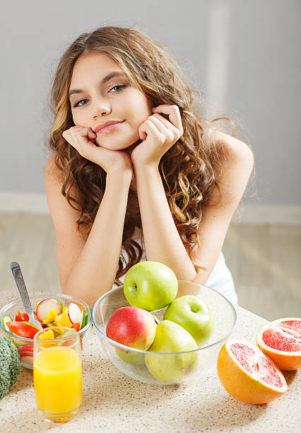 istock Young cute girl having breakfast 467760097