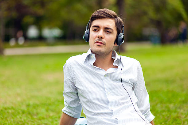 istock Young man listening to music 467761499