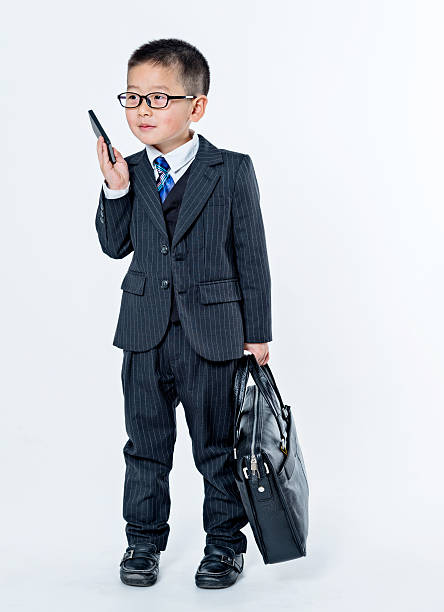 kleine junge gespräch am telefon - telephone child isolated on white elegance stock-fotos und bilder