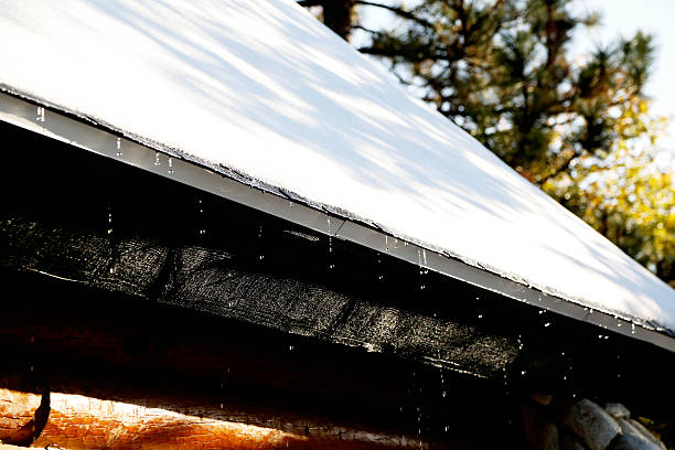 istock Snow Melting Off The Roof 467767304