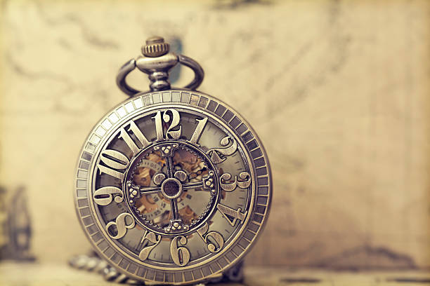 istock Old pocket watch over vintage map 467768374