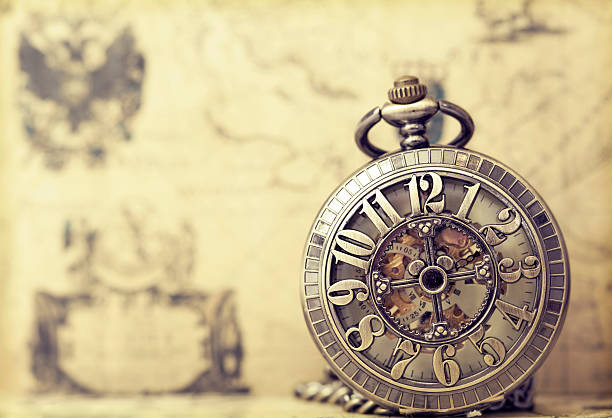 istock Old pocket watch over vintage map 467768406