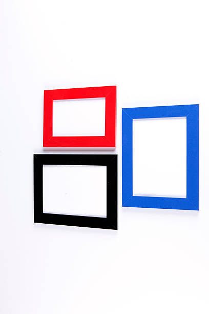 istock Three wooden photo frames, on white wall background. 467768660