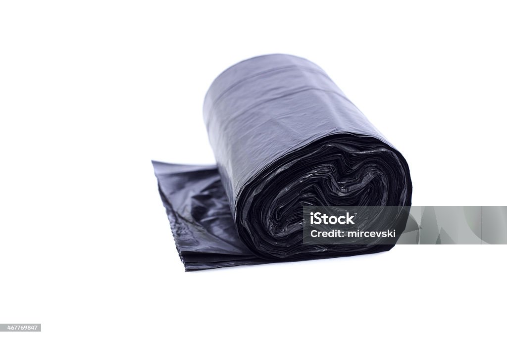 trash bags Roll of black plastic trash bags, isolated on white Bag Stock Photo