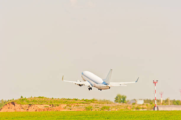 istock white passenger aircraft takes off from the strip 467770148