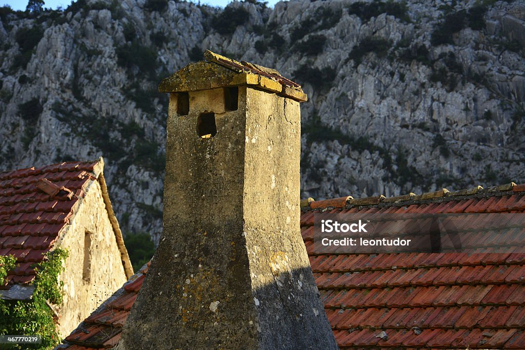 Old roof and chimney Old roof with chimney on abandoneh house Abandoned Stock Photo