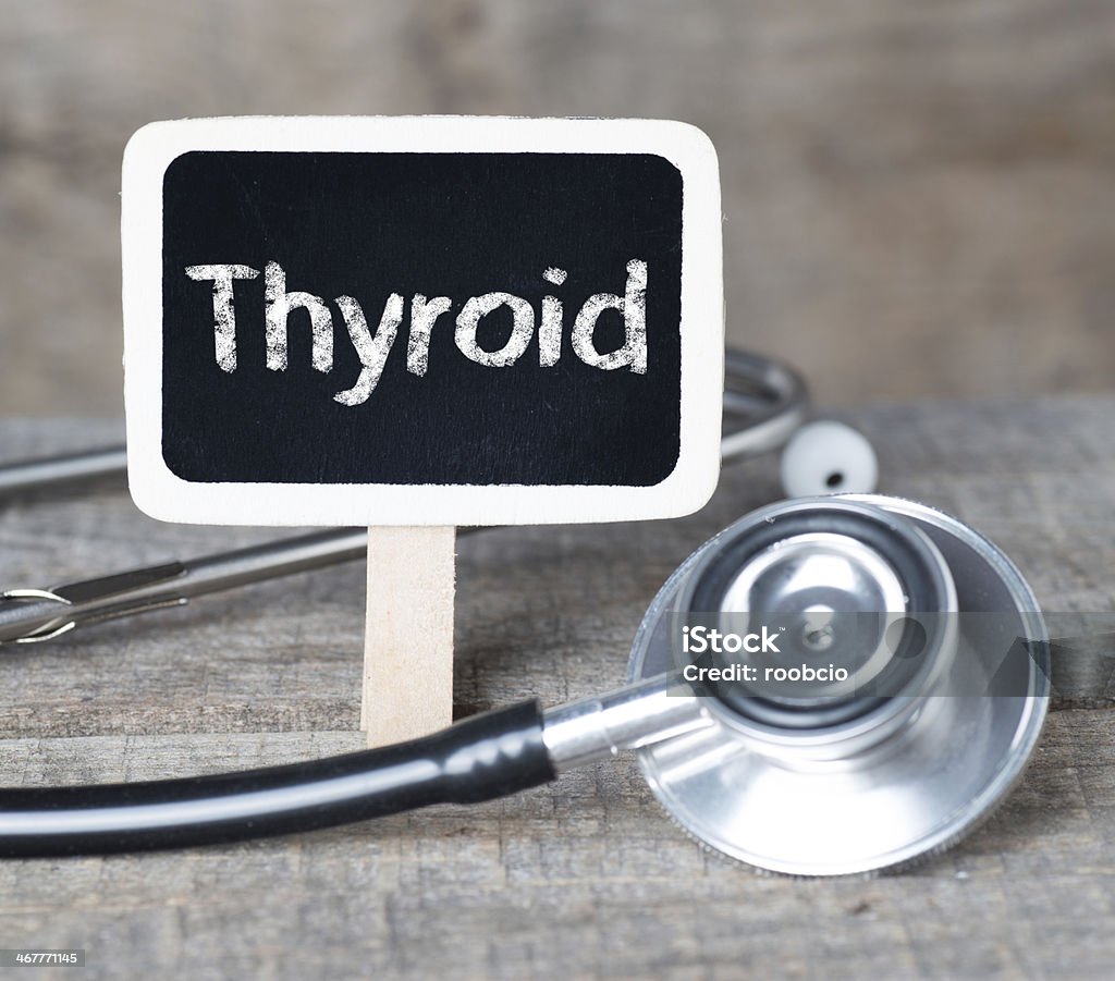 Blackboard with word Thyroid and stethoscope Medecine concept. Blackboard with word Thyroid and stethoscope Assistance Stock Photo