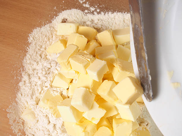 istock Add butter into flour. Making short-cut puff pastry series. 467772658