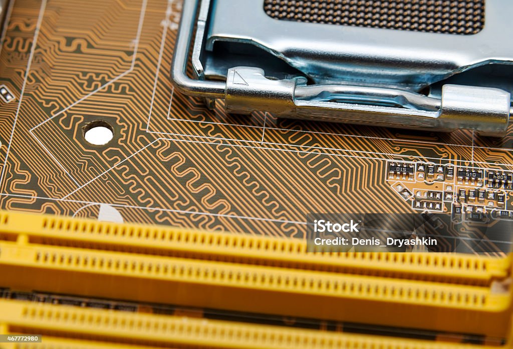 Electronic collection - computer circuit board Detail of circuit paths and solderings on a computer mainboard 2015 Stock Photo