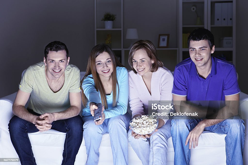 Leisure Young people watch TV at home Living Room Stock Photo