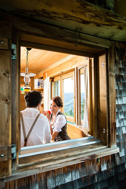 istock Young couple in a hunter's cabin eating 467780231
