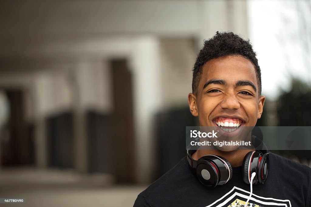 Teenager having fun listing to music African American teenager having fun listing to music. Teenage Boys Stock Photo