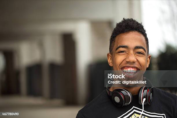 Teenager Having Fun Listing To Music Stock Photo - Download Image Now - Teenager, Black Color, Teenage Boys