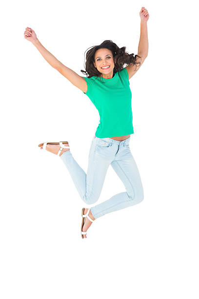 istock Pretty brunette jumping and smiling 467780670
