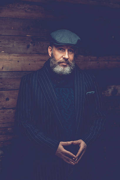 istock Middle Age Man in Black Formal Wear with Ivy Cap 467781770