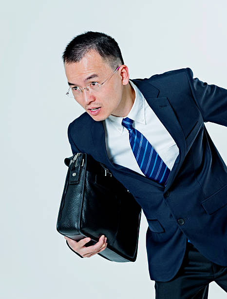 istock Asian businessman running 467782348