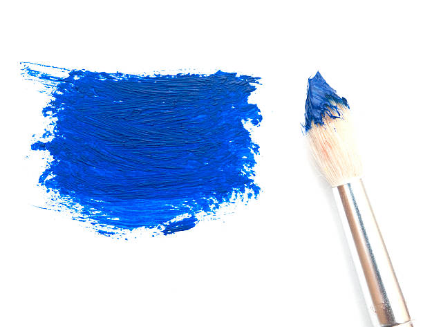 istock artist brush with blue paint on a white background 467782797