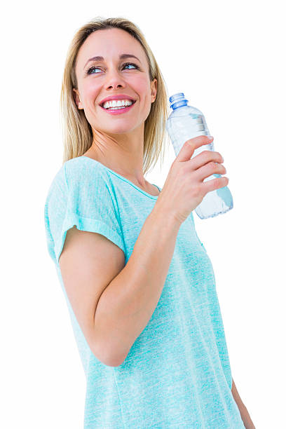 istock Smiling blonde holding bottle of water 467786332