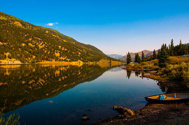 istock San Cristobal Lake Reflection with Canoe Recreation Perfection 467786704