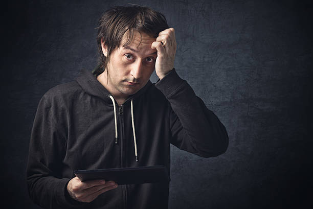 Digital Tablet Computer Noob Digital Tablet Computer Noob, Adult Caucasian Man is a Newbie in using Modern Technology Such as Portable Touch-Screen Devices. nub stock pictures, royalty-free photos & images
