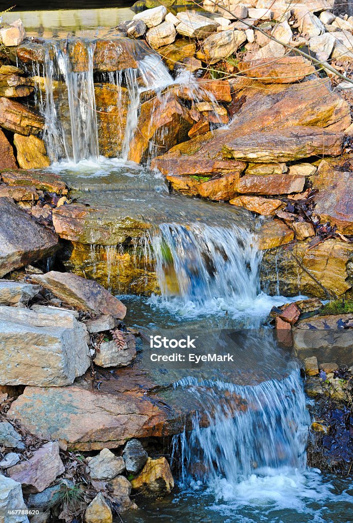 Waterfall Water Cascading over Stone Waterfall Feature 2015 Stock Photo