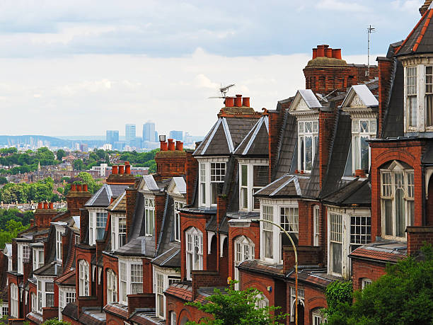 London Mansion Blocks with Canary Wharf in background Red brick London Mansion Blocks with Canary Wharf . SHot taken from Muswell Hill. wandsworth photos stock pictures, royalty-free photos & images
