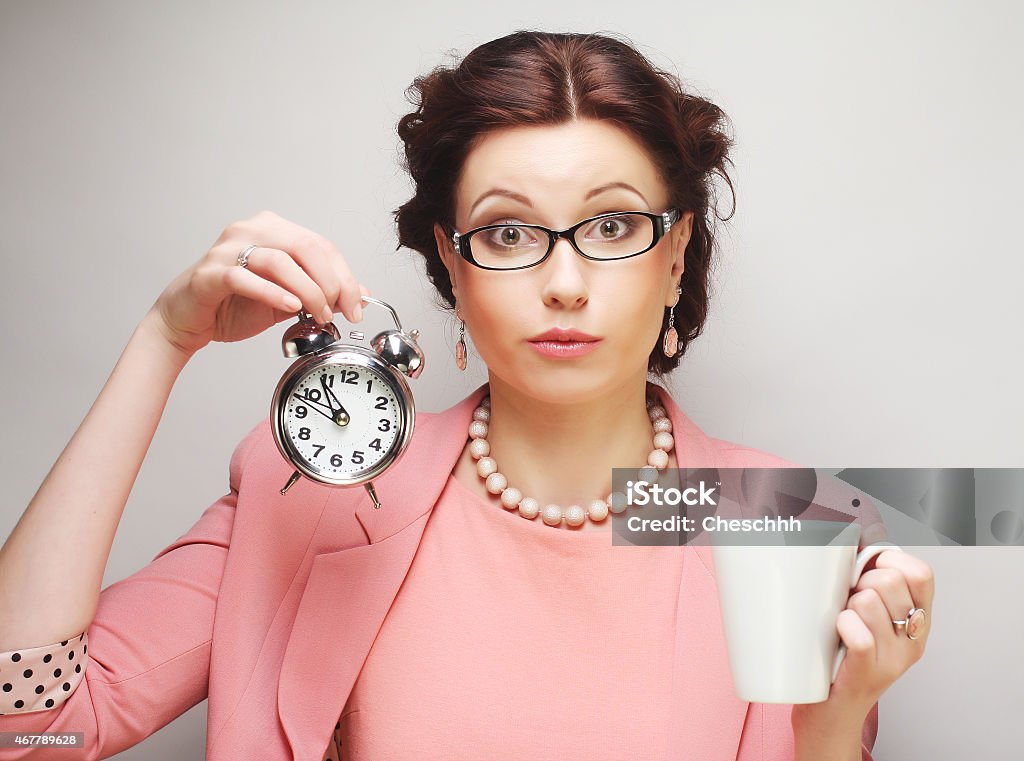 Young businesswoman having a coffee-break Young funny businesswoman having a coffee-break 2015 Stock Photo