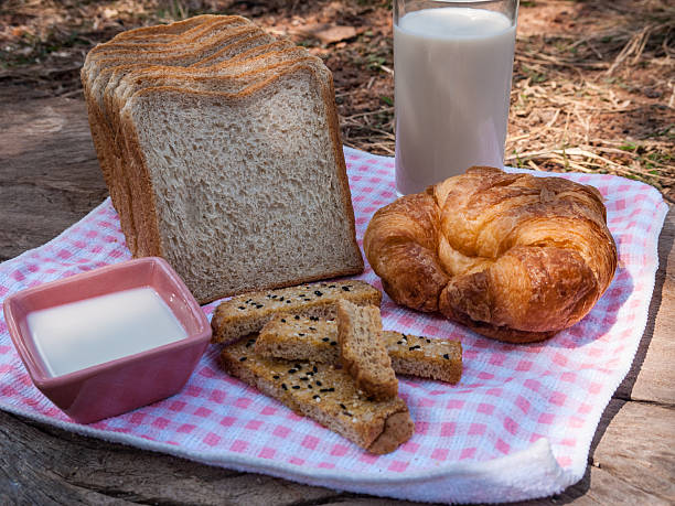 Freshly toasted salt and sesame bread, croissant,milk