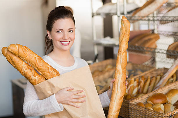 istock Pretty brunette holding bag of bread 467791800
