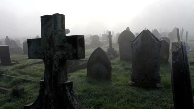 Misty Foggy Spooky Graveyard With Old Tombstones And Grave Headstones